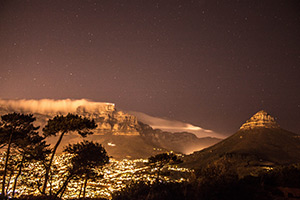 Mountain, city and stars in the sky
