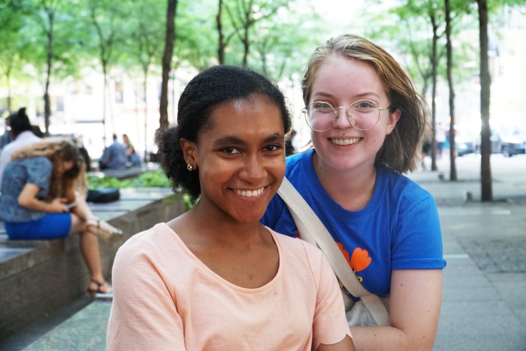 Two young women smiling