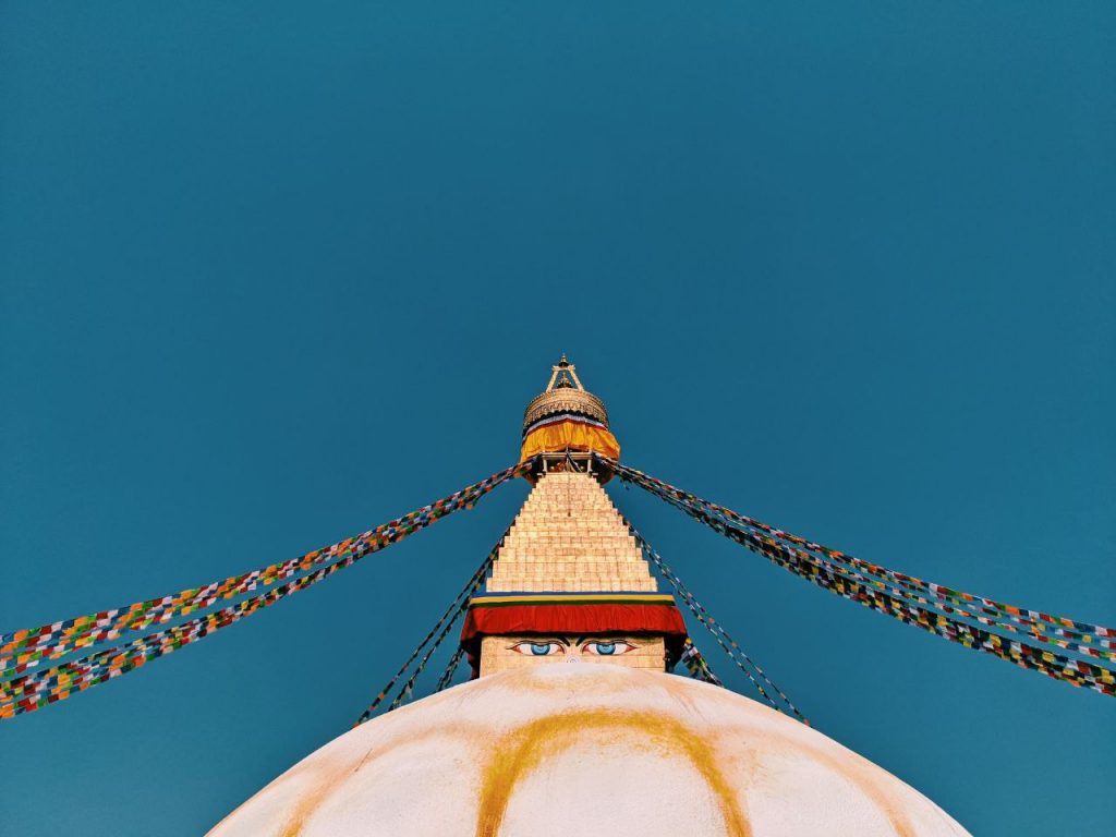 Boudhanath Stupa -- a dome with crown and prayer flags