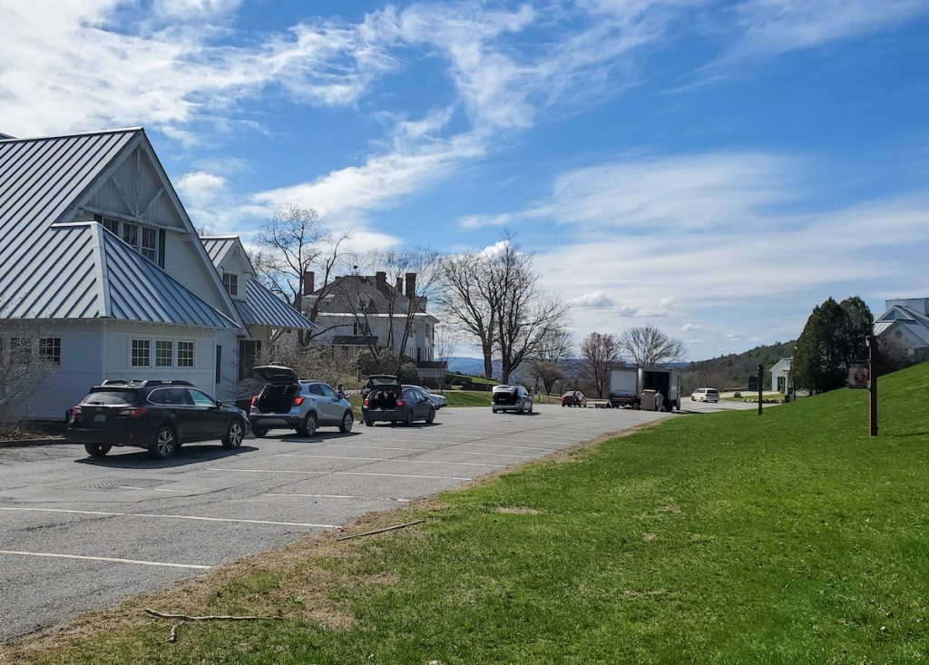 A line of cars waits to receive food at a distribution event on the World Learning and SIT campus in Vermont.