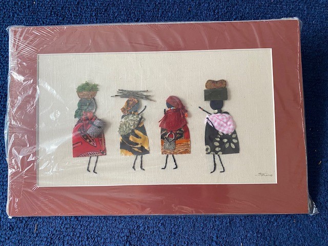 A quilt square depicts Botswana women in colorful prints, some carrying items on their heads