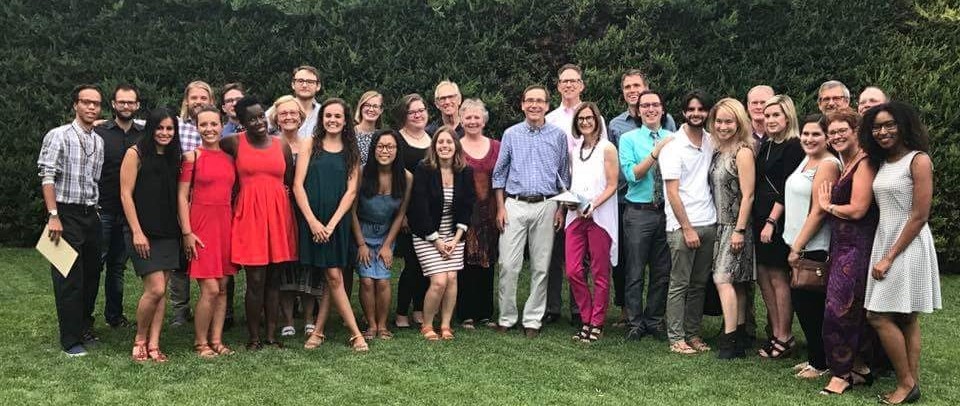 A large group of people smiling for the camera.