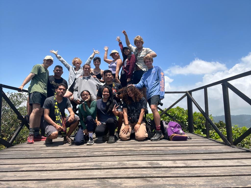 U.S. and Panamanian students posing for a group picture from a lookout point atop a mountain